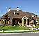 European home plan with arched dormers